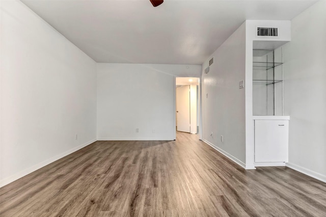 unfurnished room featuring hardwood / wood-style floors