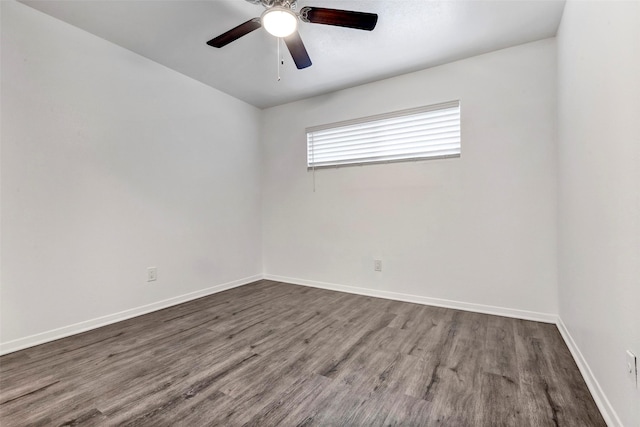 spare room with hardwood / wood-style floors and ceiling fan