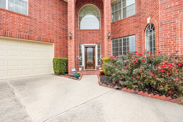 doorway to property with a garage