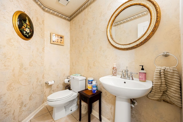 bathroom with toilet and tile patterned flooring