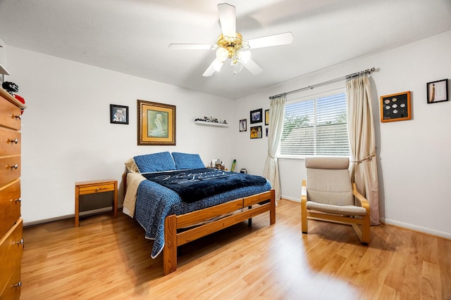 bedroom with ceiling fan and light wood-type flooring