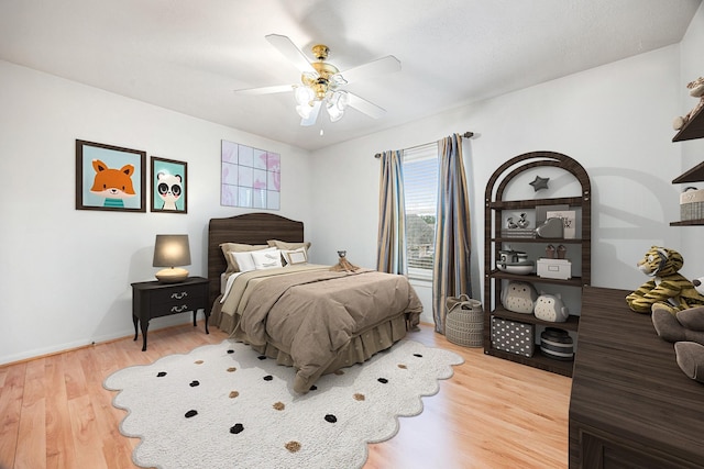 bedroom featuring ceiling fan and hardwood / wood-style floors