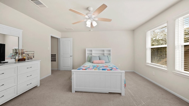 bedroom featuring ceiling fan and light carpet