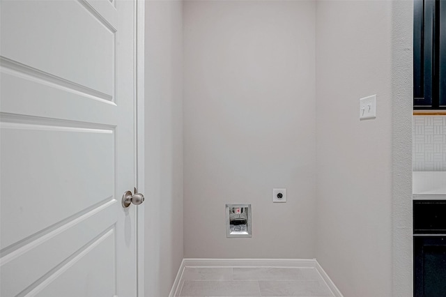 washroom with hookup for an electric dryer, light tile patterned floors, and hookup for a washing machine