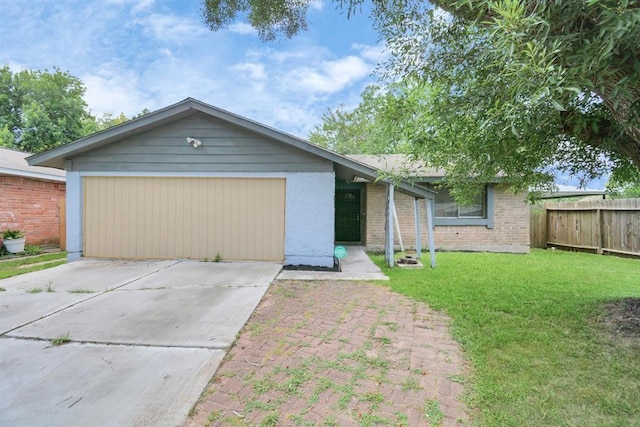 ranch-style home featuring a garage and a front lawn