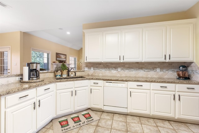 kitchen with dishwasher, tasteful backsplash, white cabinetry, and sink