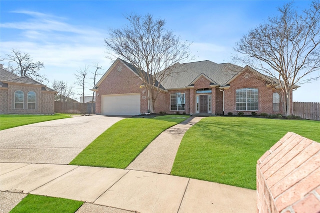 ranch-style home featuring a front yard and a garage