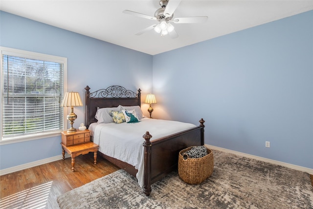 bedroom featuring ceiling fan and hardwood / wood-style flooring