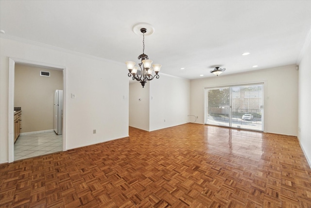 interior space featuring dark parquet flooring, crown molding, and a notable chandelier