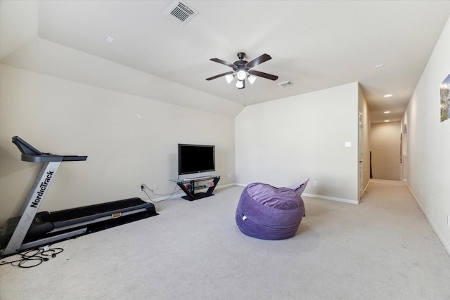 workout room featuring light carpet, vaulted ceiling, and ceiling fan