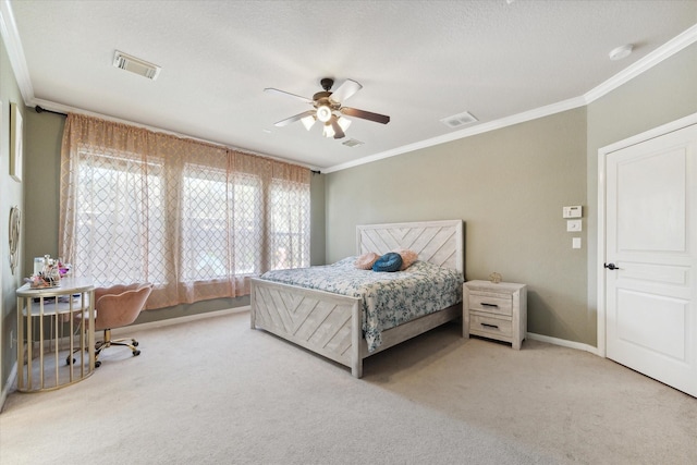 bedroom featuring ceiling fan, carpet floors, and ornamental molding