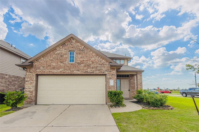 view of front of property featuring a garage and a front lawn