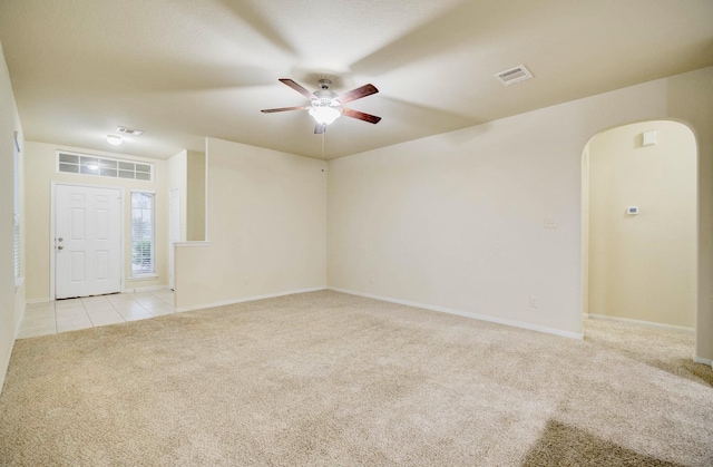 carpeted empty room with ceiling fan