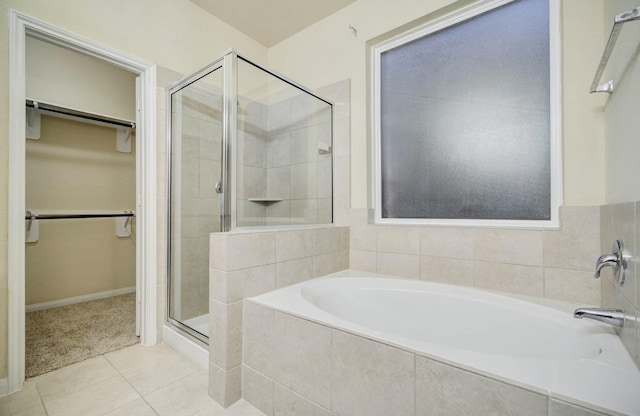 bathroom featuring tile patterned floors and plus walk in shower