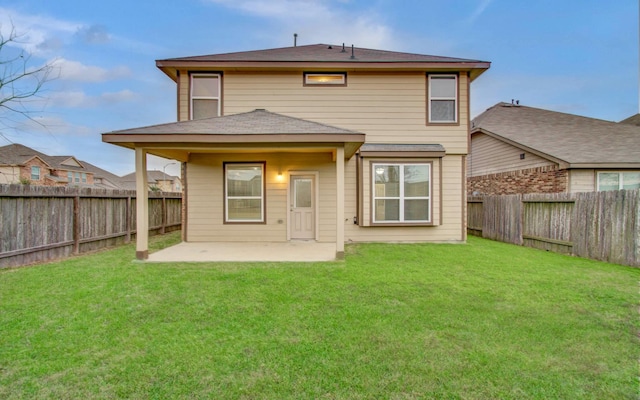 rear view of property with a patio area and a yard