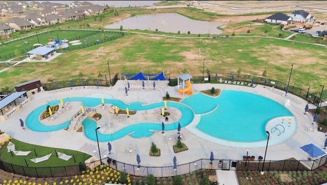 view of pool featuring a water view