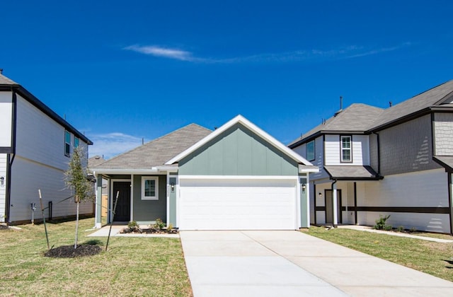 view of front of house with a garage, board and batten siding, concrete driveway, and a front lawn