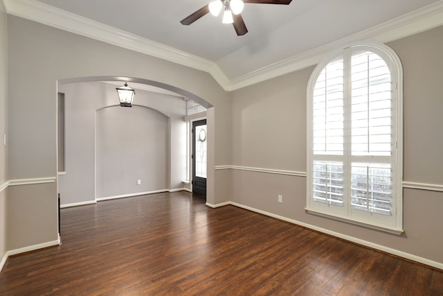 spare room featuring ceiling fan, ornamental molding, dark wood-type flooring, and lofted ceiling