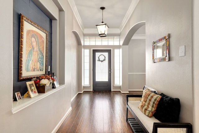 entryway featuring dark hardwood / wood-style flooring and ornamental molding