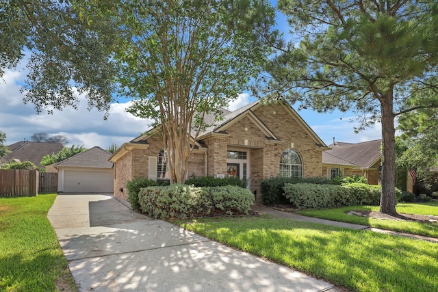 view of front of home with a garage and a front yard