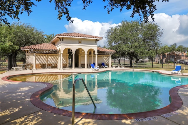 view of pool featuring a patio