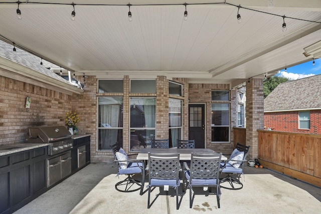 view of patio / terrace featuring grilling area and an outdoor kitchen