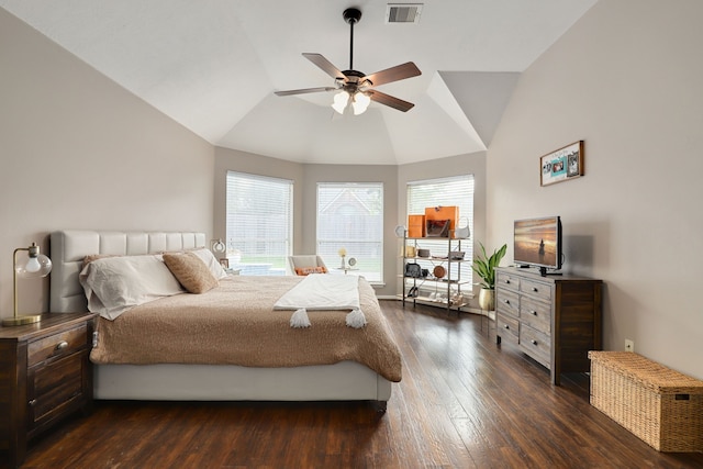 bedroom with multiple windows, ceiling fan, dark wood-type flooring, and lofted ceiling