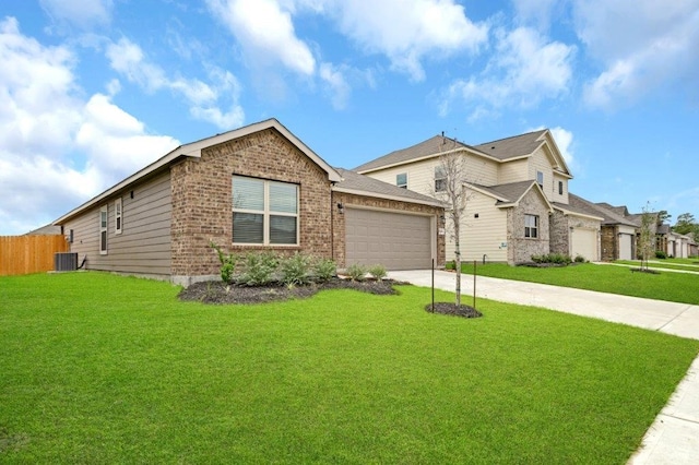 view of front of home with central AC unit, a garage, and a front lawn