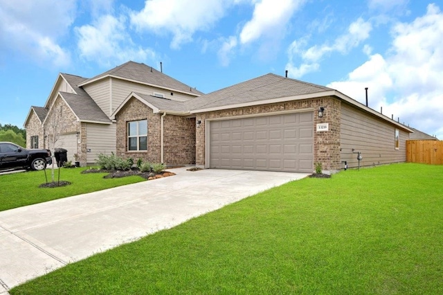 view of front facade featuring a front lawn and a garage