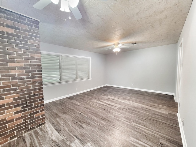 unfurnished room with dark wood-type flooring