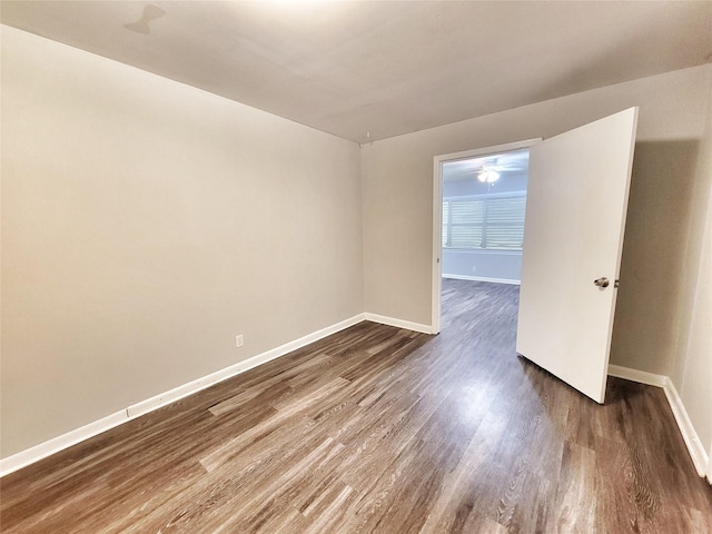 unfurnished room featuring dark hardwood / wood-style floors