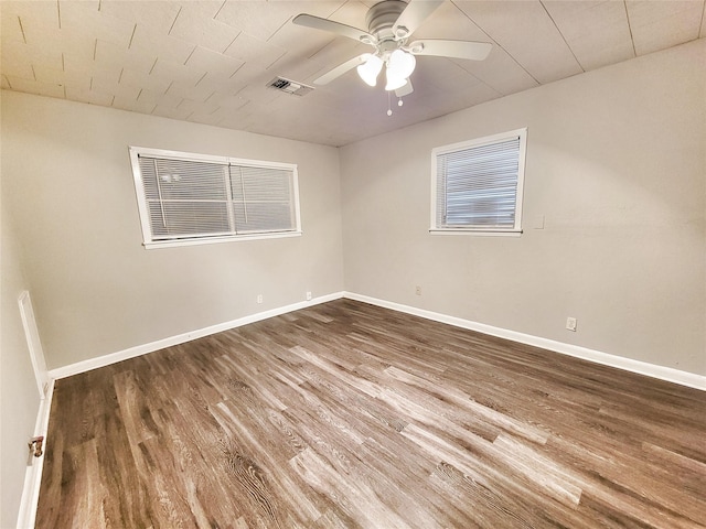 empty room with hardwood / wood-style floors and ceiling fan