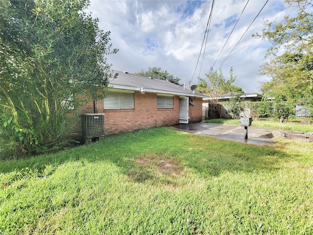 view of yard with a patio and central AC