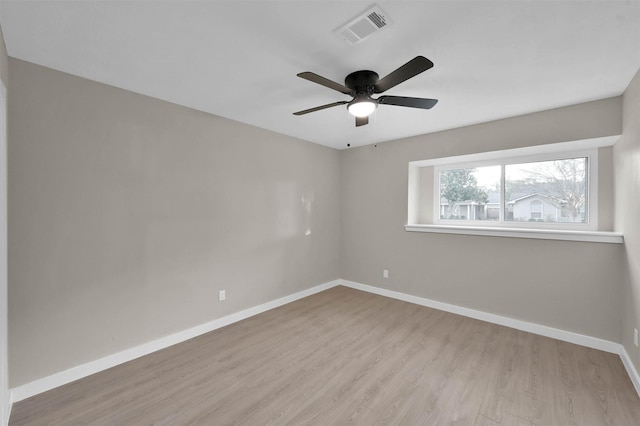 spare room featuring ceiling fan and light wood-type flooring