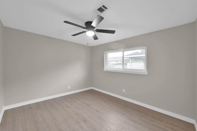 empty room featuring ceiling fan and light wood-type flooring