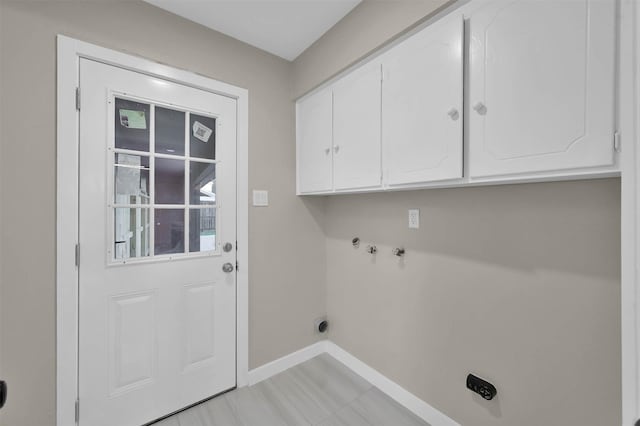 washroom with washer hookup, cabinets, and electric dryer hookup