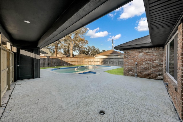 view of patio / terrace with a fenced in pool