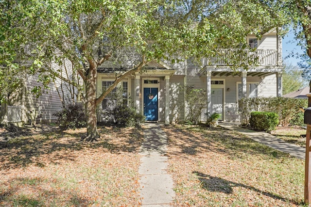 view of front of home with a balcony