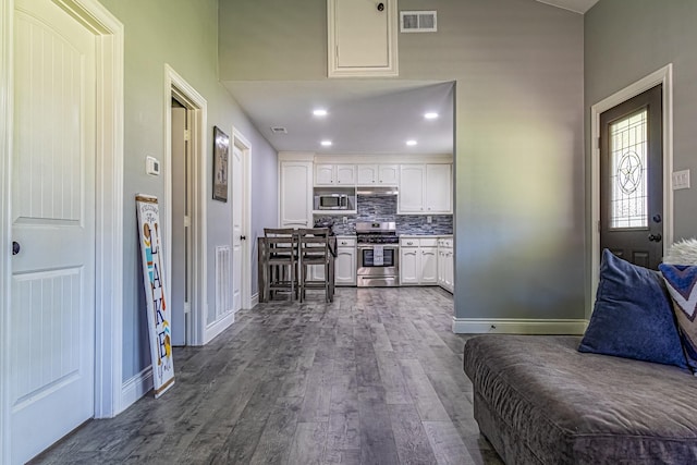 interior space with dark hardwood / wood-style floors