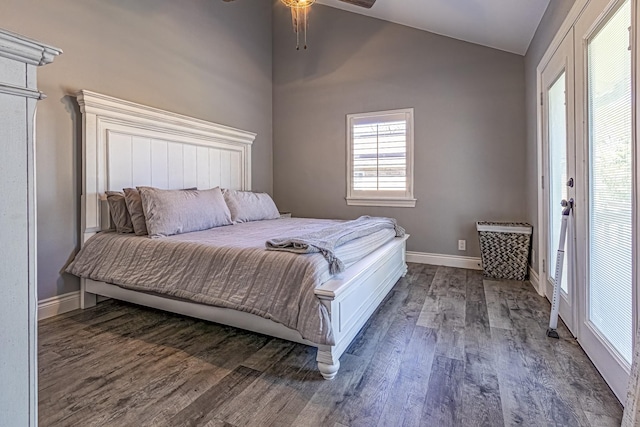 bedroom with lofted ceiling, ceiling fan, and dark wood-type flooring