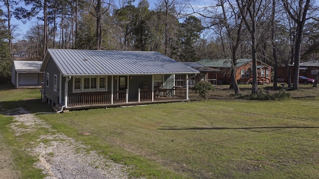 view of front of house featuring covered porch and a front yard