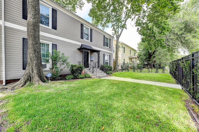 view of front of property with a front lawn