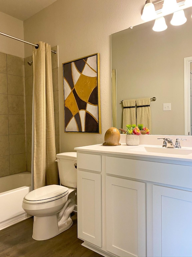 full bathroom with vanity, wood-type flooring, shower / tub combo, and toilet