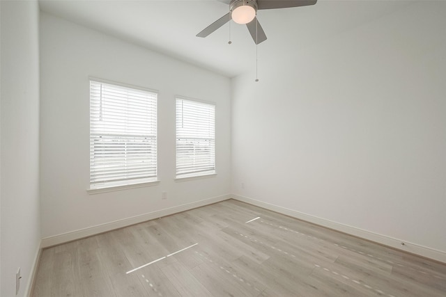 empty room with light wood-type flooring and ceiling fan