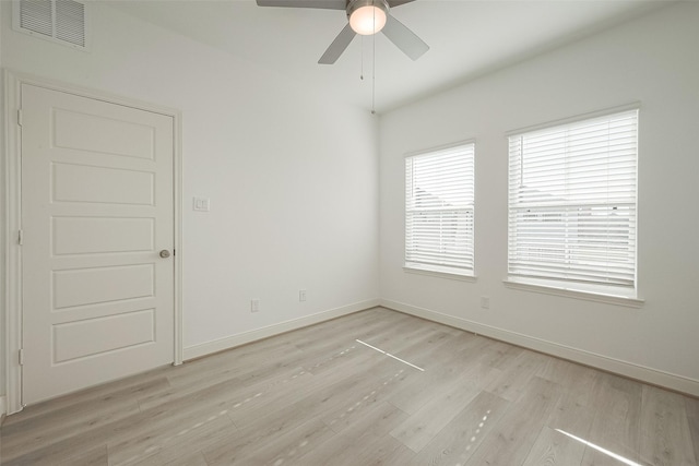 spare room with light hardwood / wood-style flooring and ceiling fan