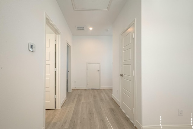 corridor with light wood-type flooring