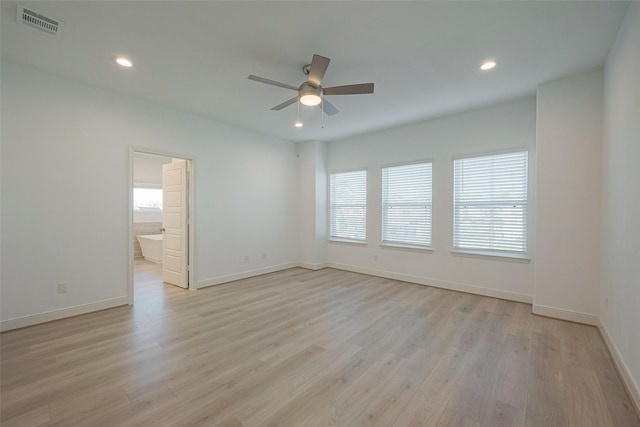 unfurnished room with ceiling fan and light hardwood / wood-style flooring