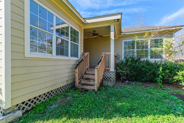 doorway to property featuring ceiling fan