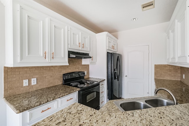 kitchen with white cabinetry, sink, light stone countertops, backsplash, and black appliances