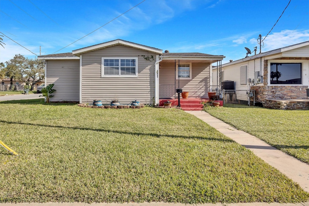 bungalow-style home with a front yard